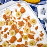 banana pudding poke cake in a white baking dish