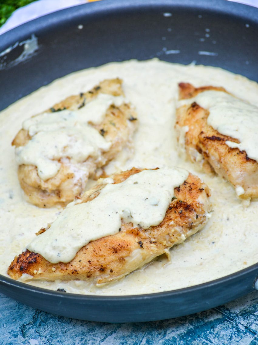 creamy lemon chicken in a black skillet