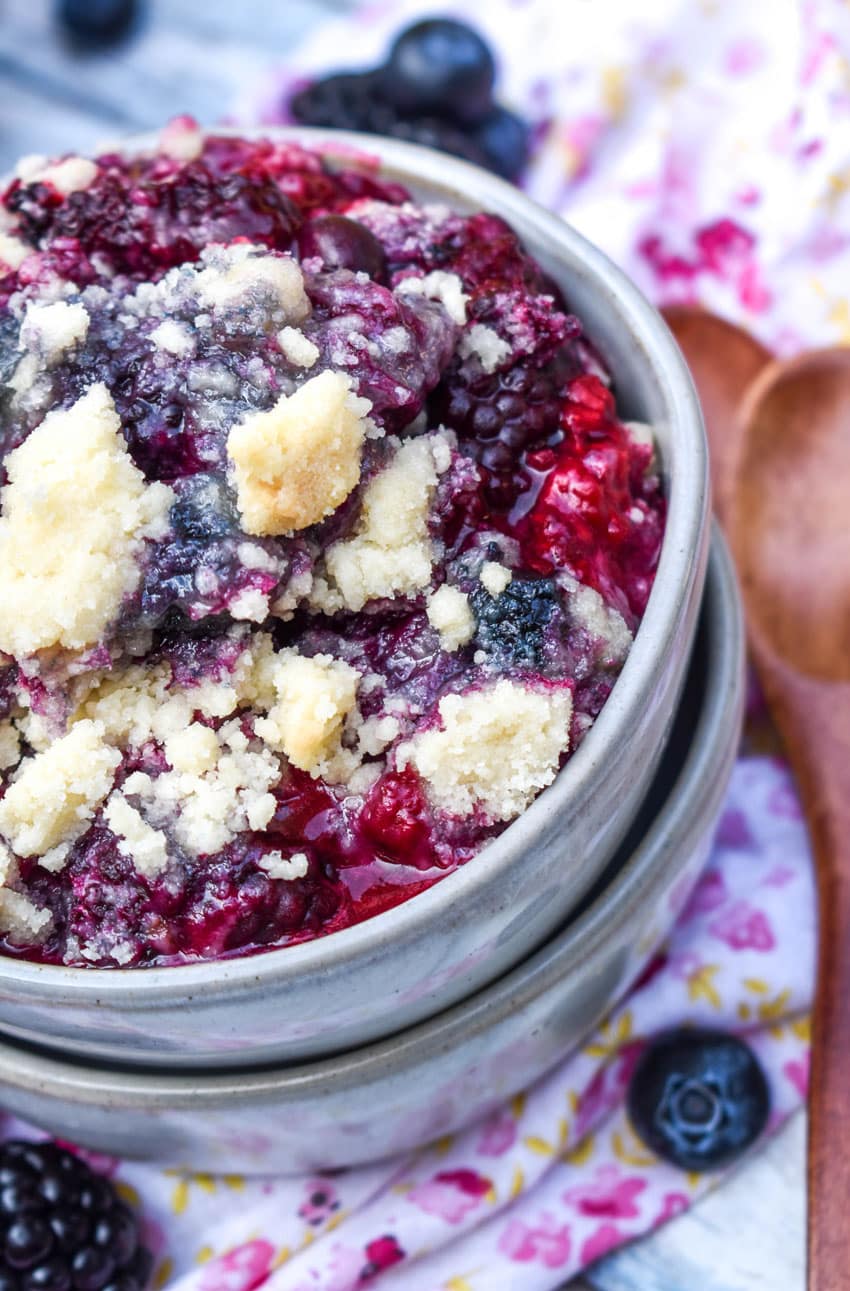 dump and bake berry cobbler with sugar cookie crust in a small gray bowl