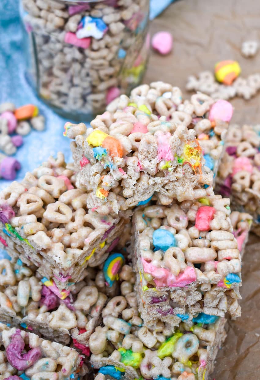 a stack of lucky charms treats on wrinkled brown parchment paper