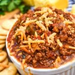 easy no bean chili recipe in a white bowl topped with shredded cheese
