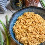 sesame garlic ramen noodles in a blue bowl