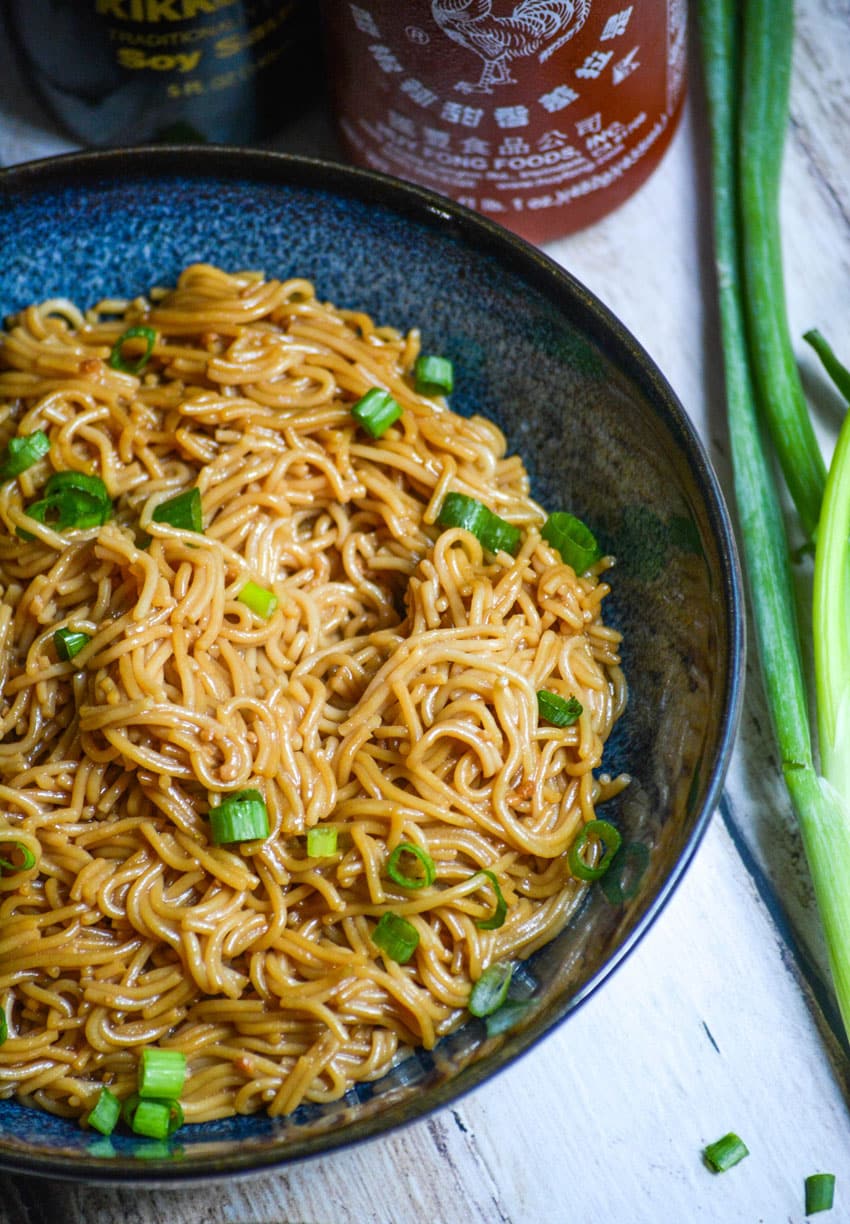 sesame garlic ramen noodles in a blue bowl