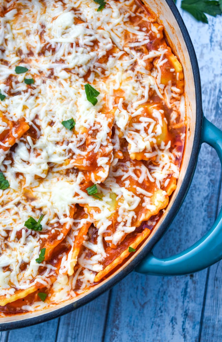 skillet ravioli lasagna in a large blue dutch oven