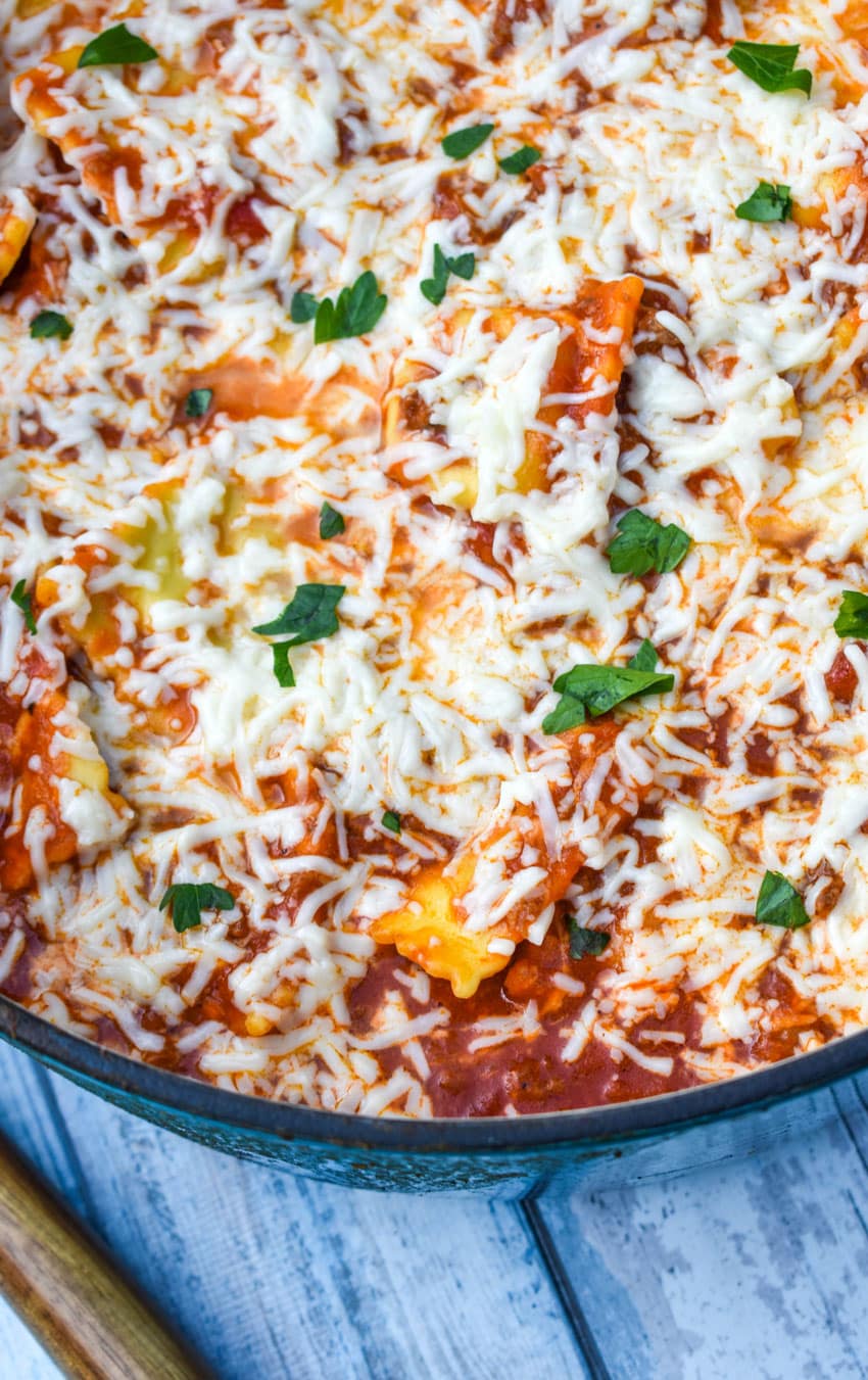 skillet ravioli lasagna in a large blue dutch oven