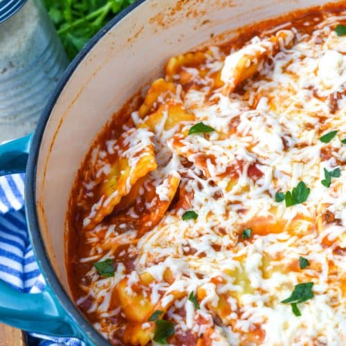 skillet ravioli lasagna in a large blue dutch oven