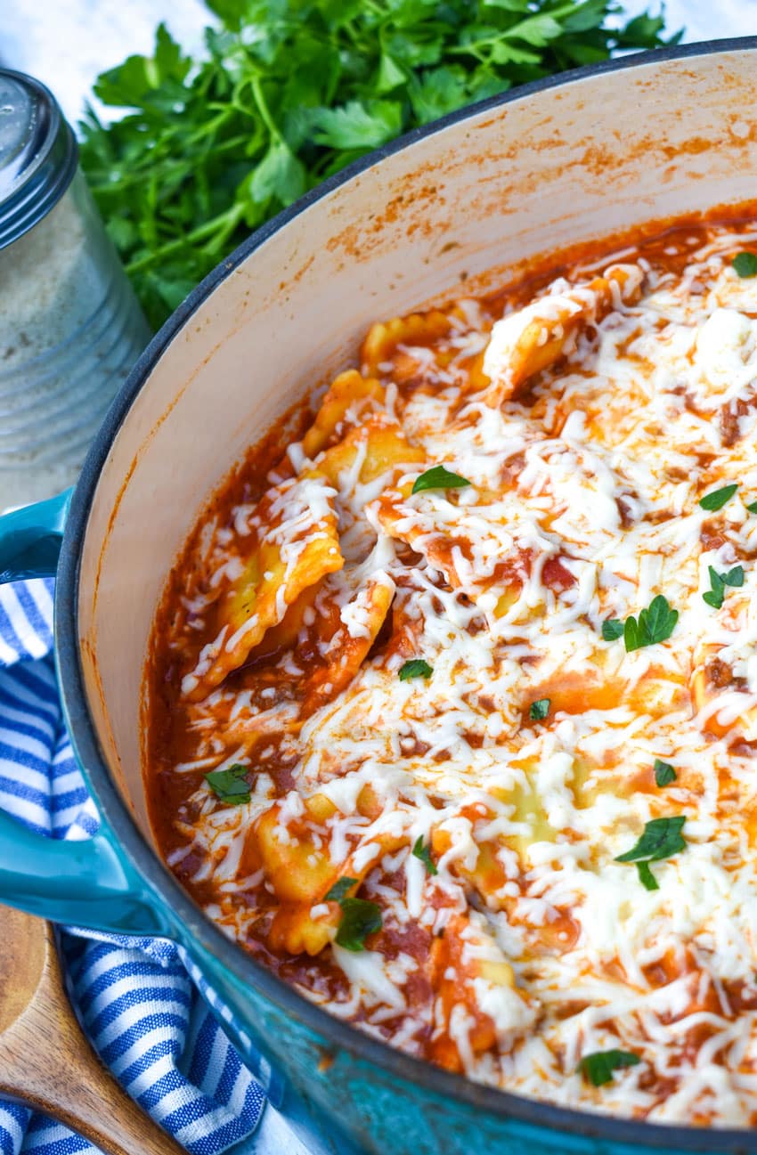 skillet ravioli lasagna in a large blue dutch oven