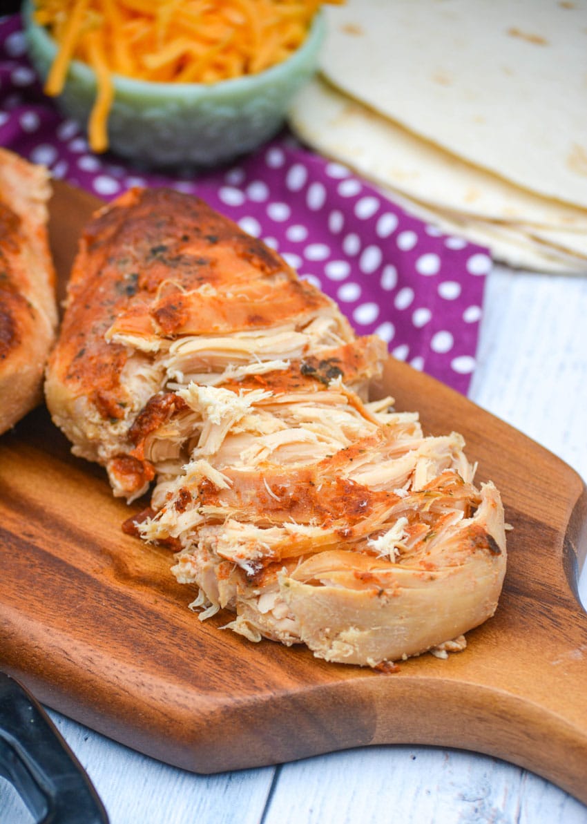 Slow Cooker Cool Ranch Chicken slow cooker cool ranch chicken on a wooden cutting board