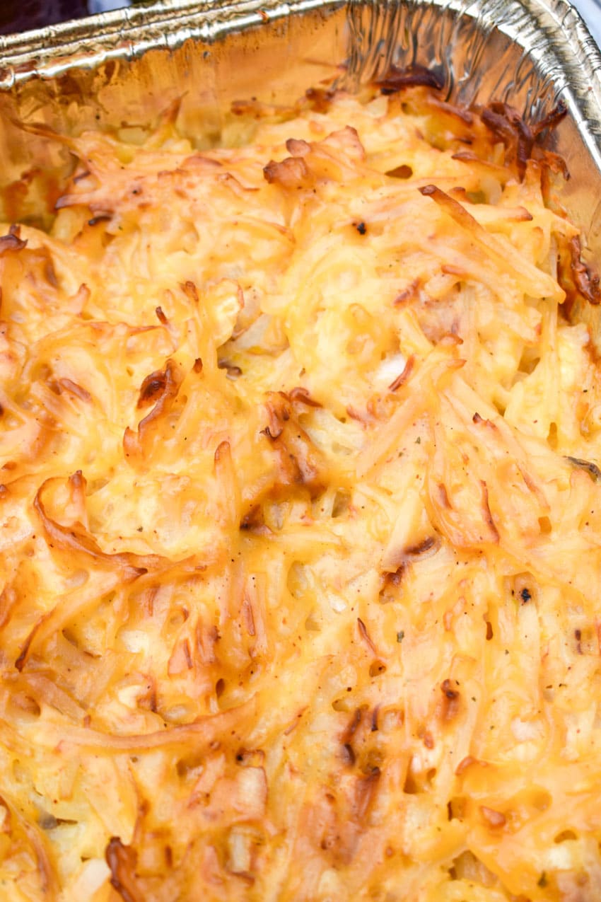 cheesy smoked potatoes in a 9x13 aluminum tin