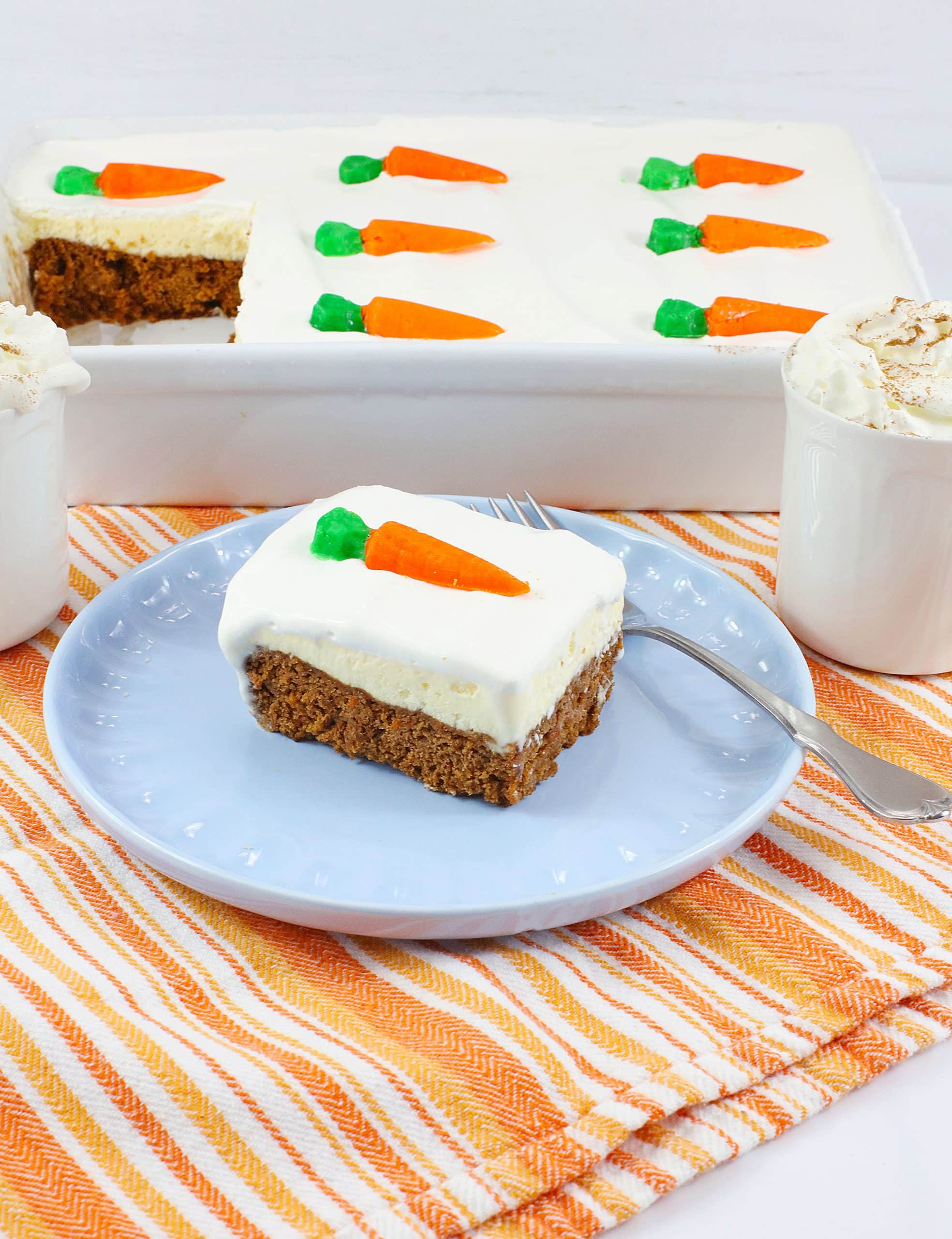 a slice of carrot cake ice cream cake on a light blue plate
