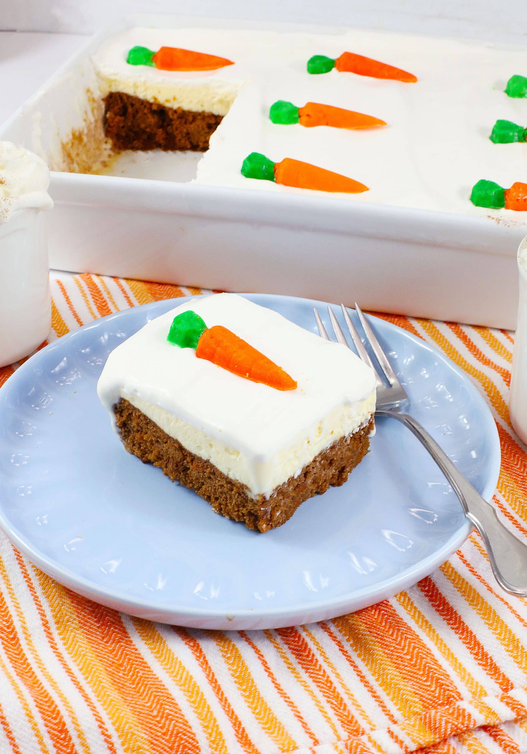 a slice of carrot cake ice cream cake on a light blue plate