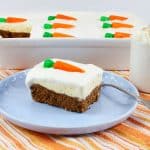 a slice of carrot cake ice cream cake on a light blue plate