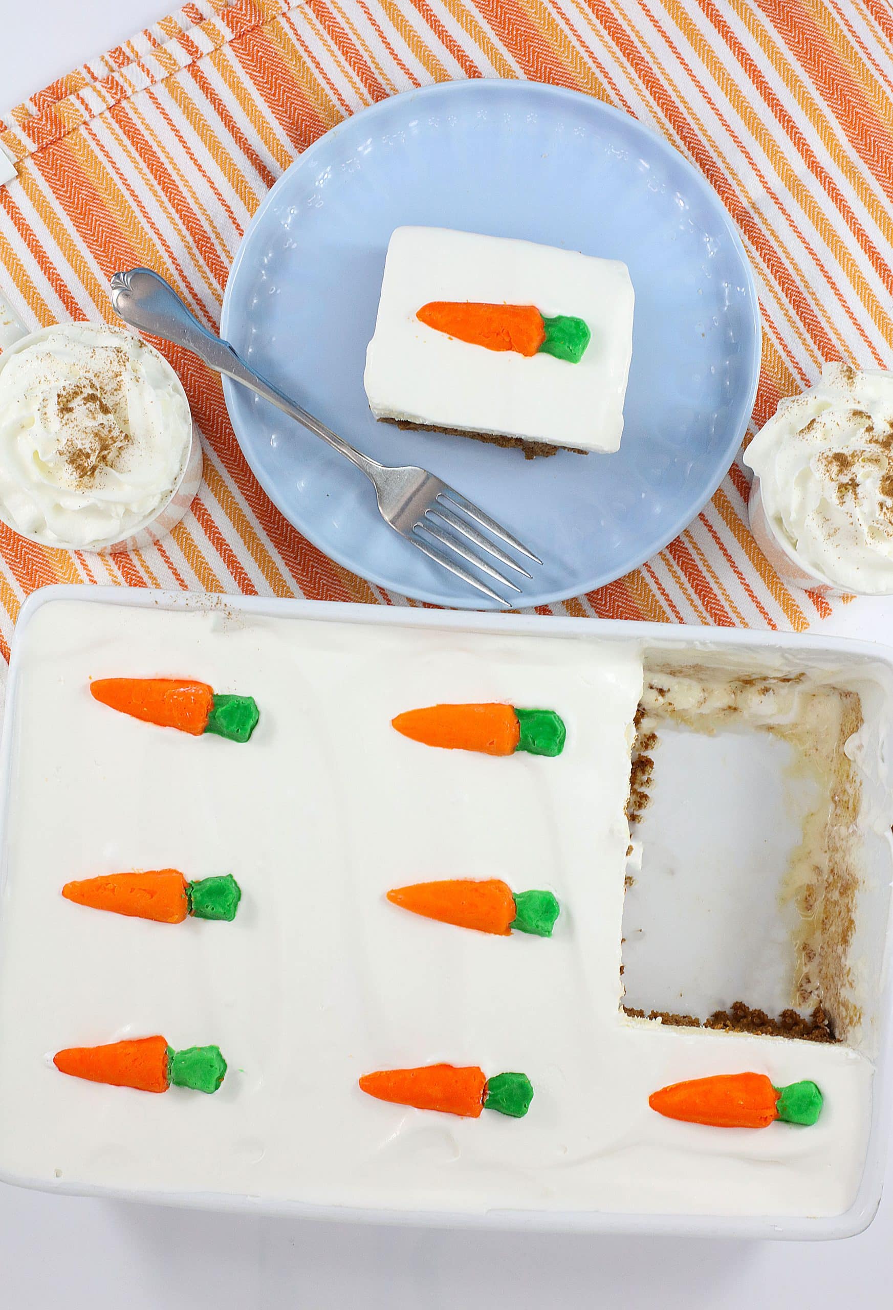 a slice of carrot cake ice cream cake on a light blue plate