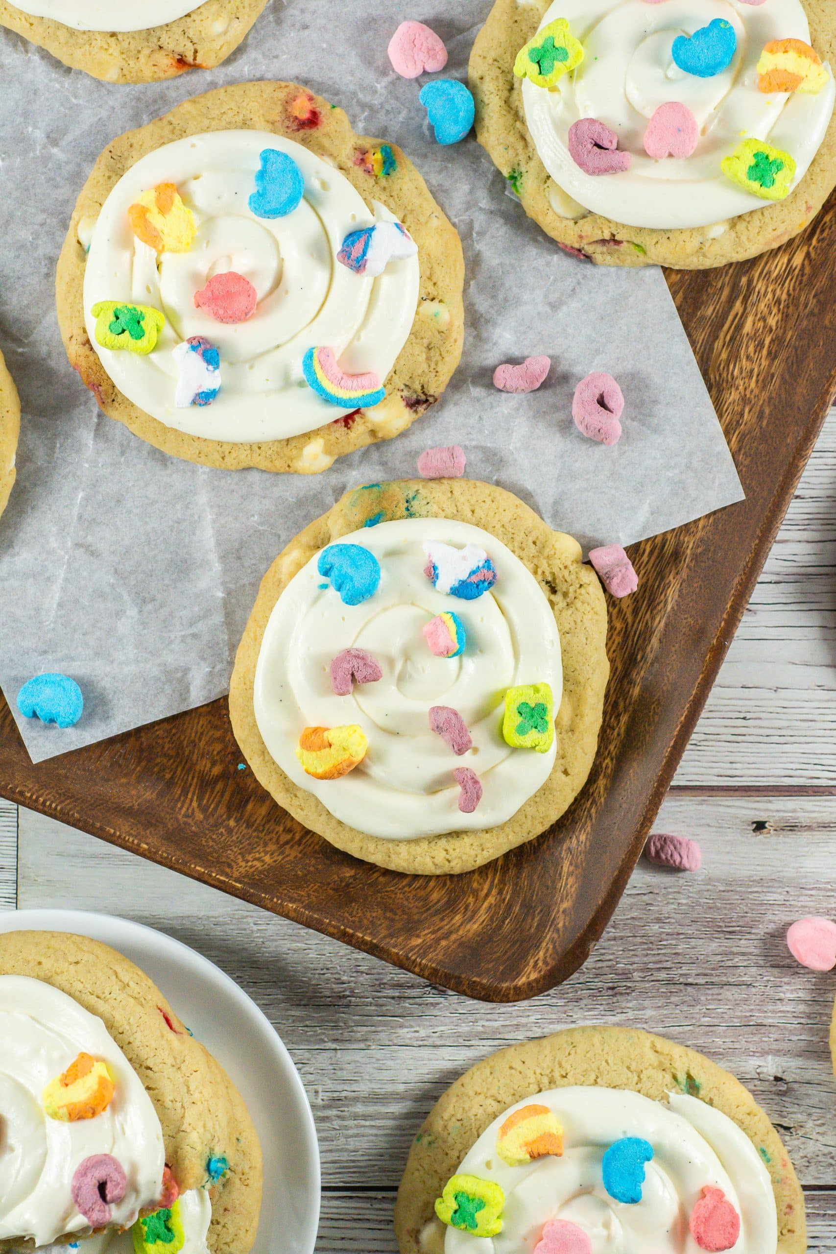 lucky charms cookies on a wooden cutting board