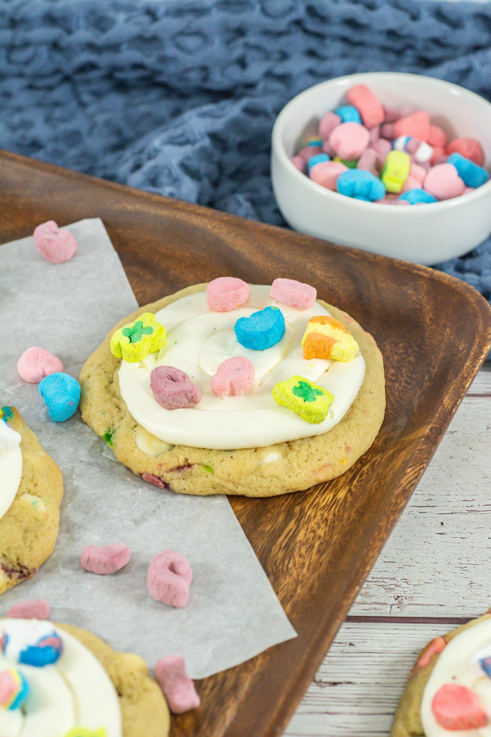 lucky charms cookies on a wooden cutting board