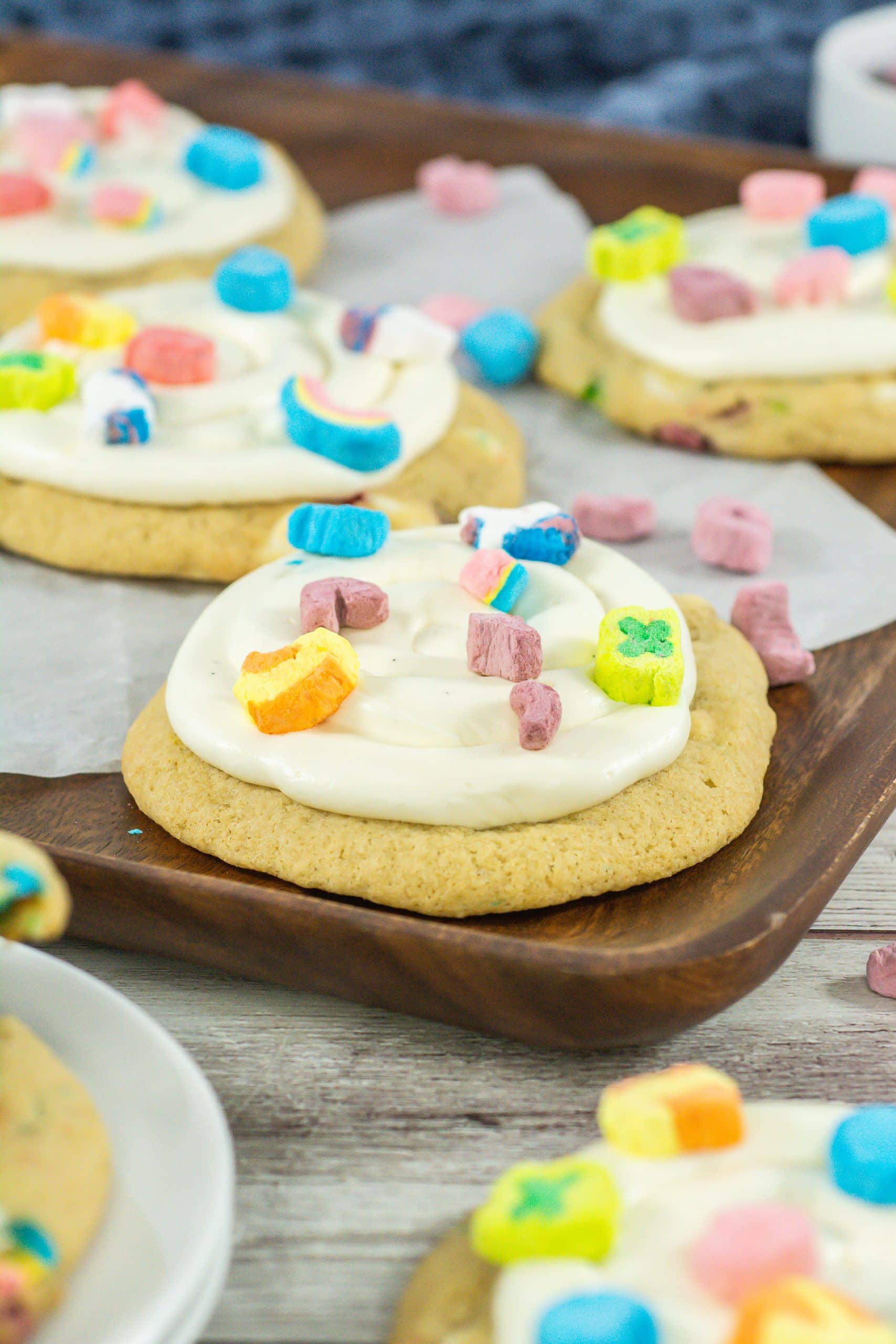 lucky charms cookies on a wooden cutting board