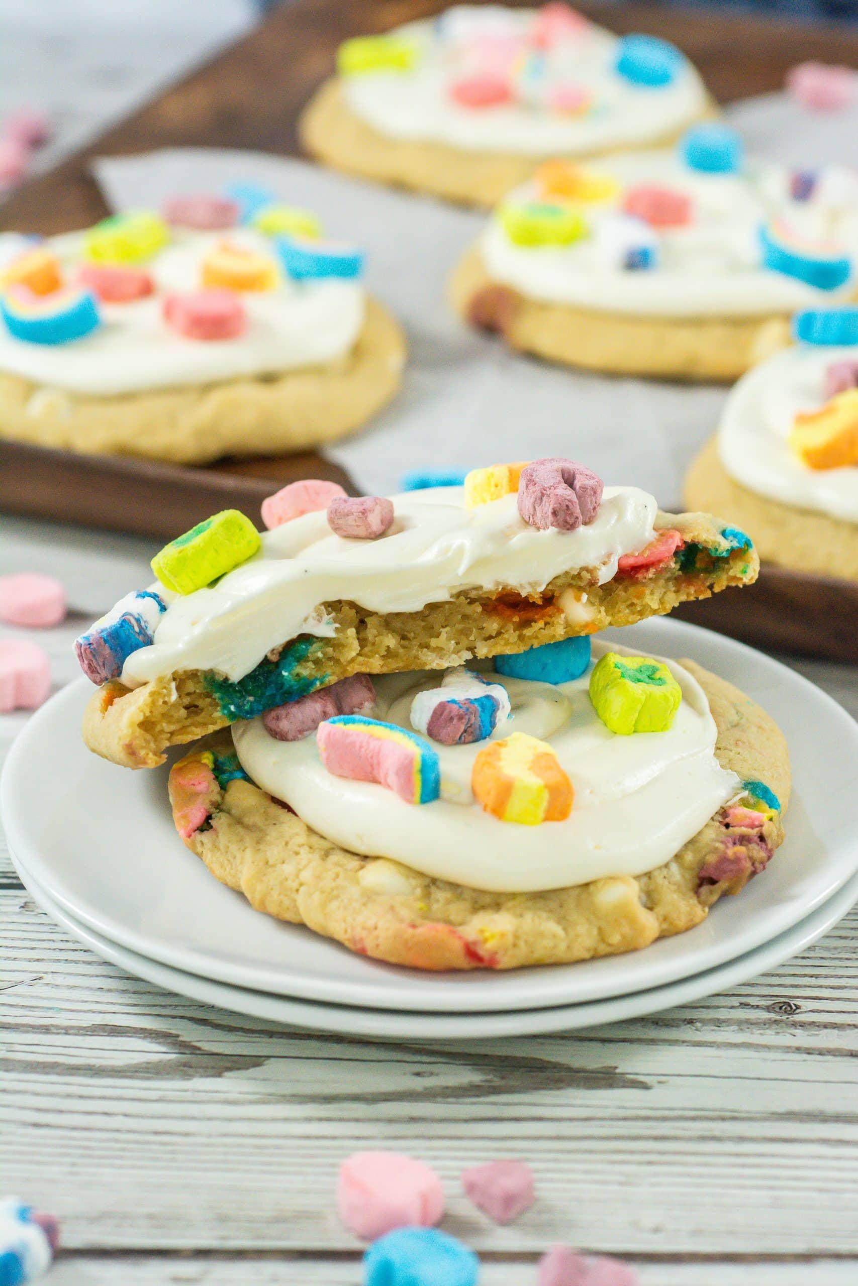 two lucky charms cookies on a small white dessert plate