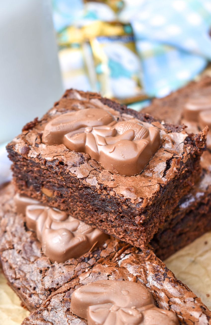 easy easter bunny brownies stacked on brown parchment paper