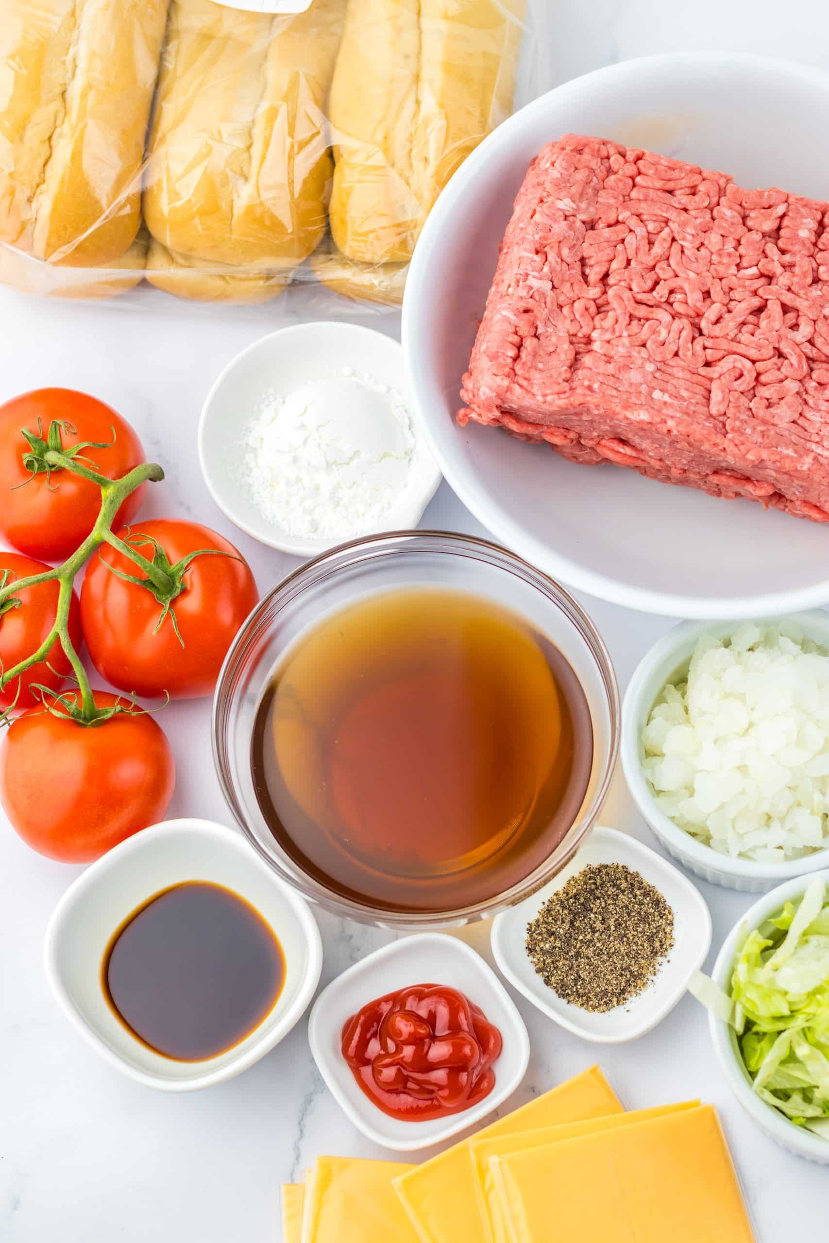 an overhead image showing the measured ingredients needed to make a chopped cheese sandwich in the slow cooker