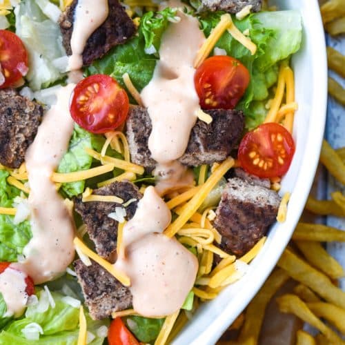 big mac salad in a large white serving bowl