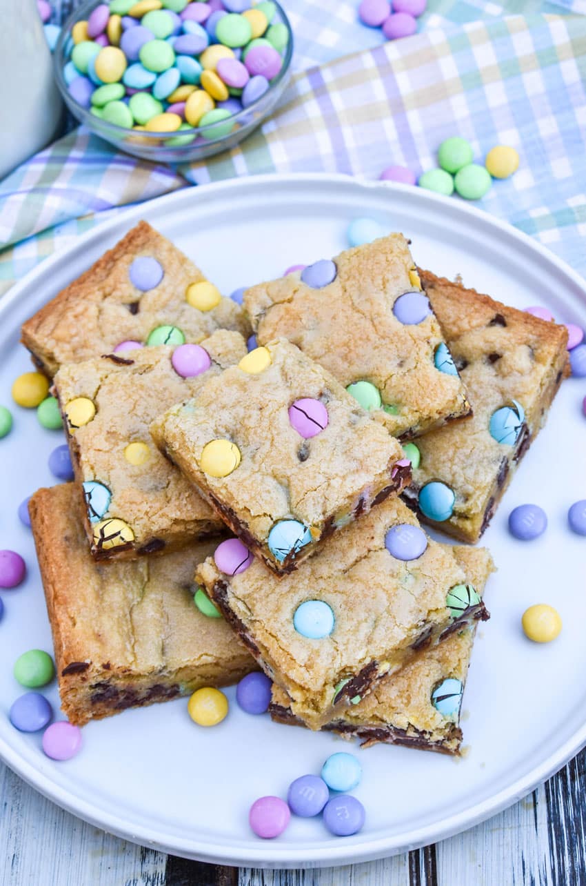 cut squares Easter cookie bars stacked on a white plate