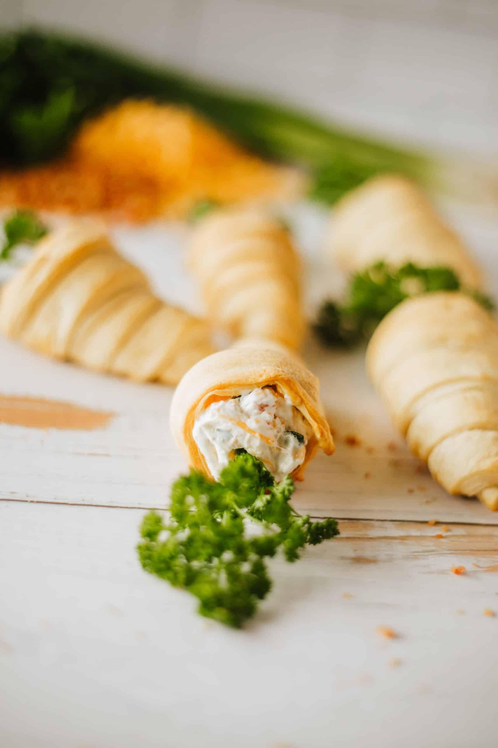 carrot crescent rolls on a wooden tabletop