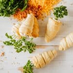 carrot crescent rolls on a wooden tabletop