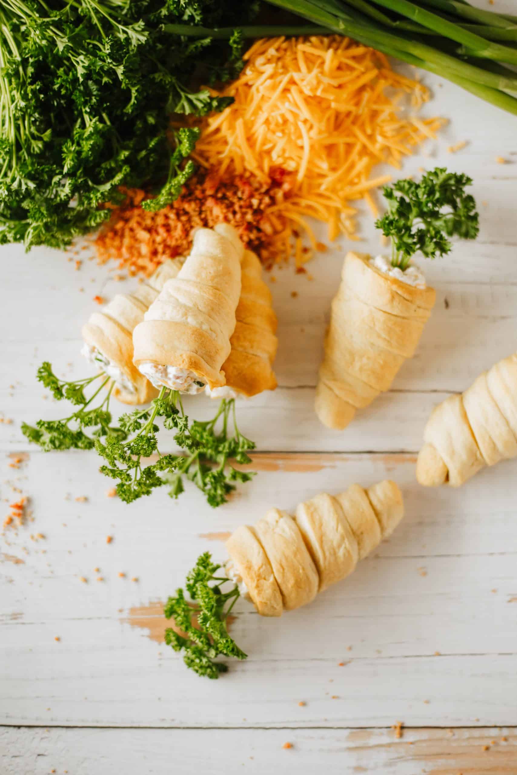 carrot crescent rolls on a wooden tabletop