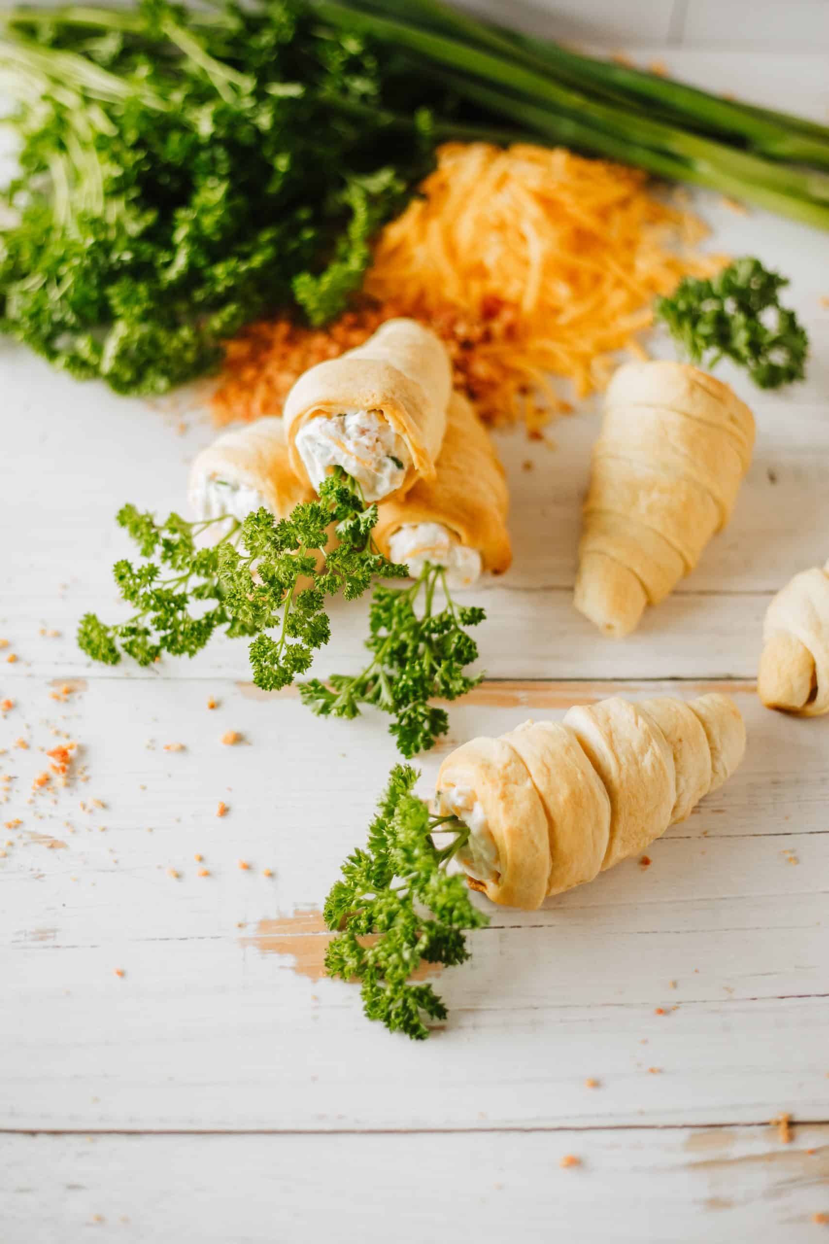 carrot crescent rolls on a wooden tabletop