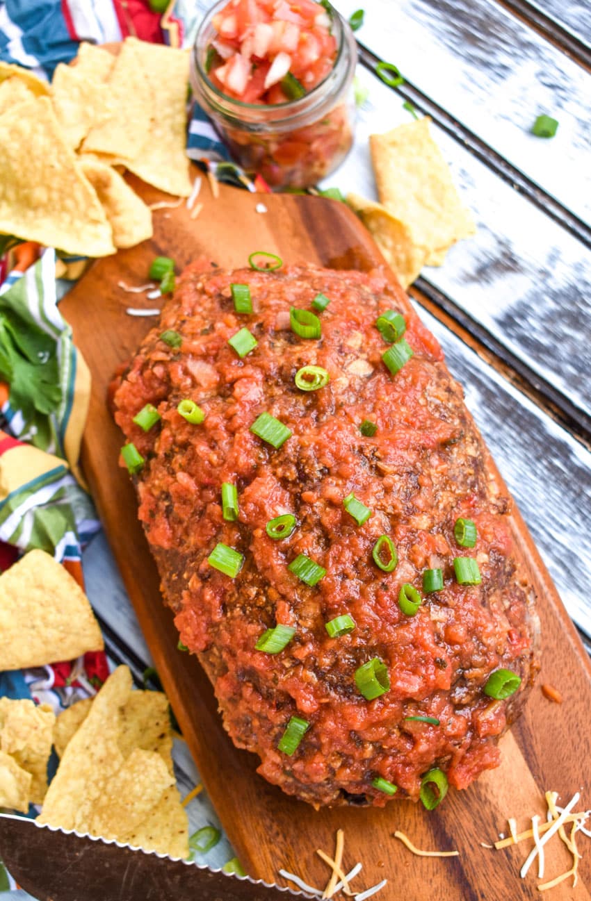 a mexican meatloaf on a wooden cutting board