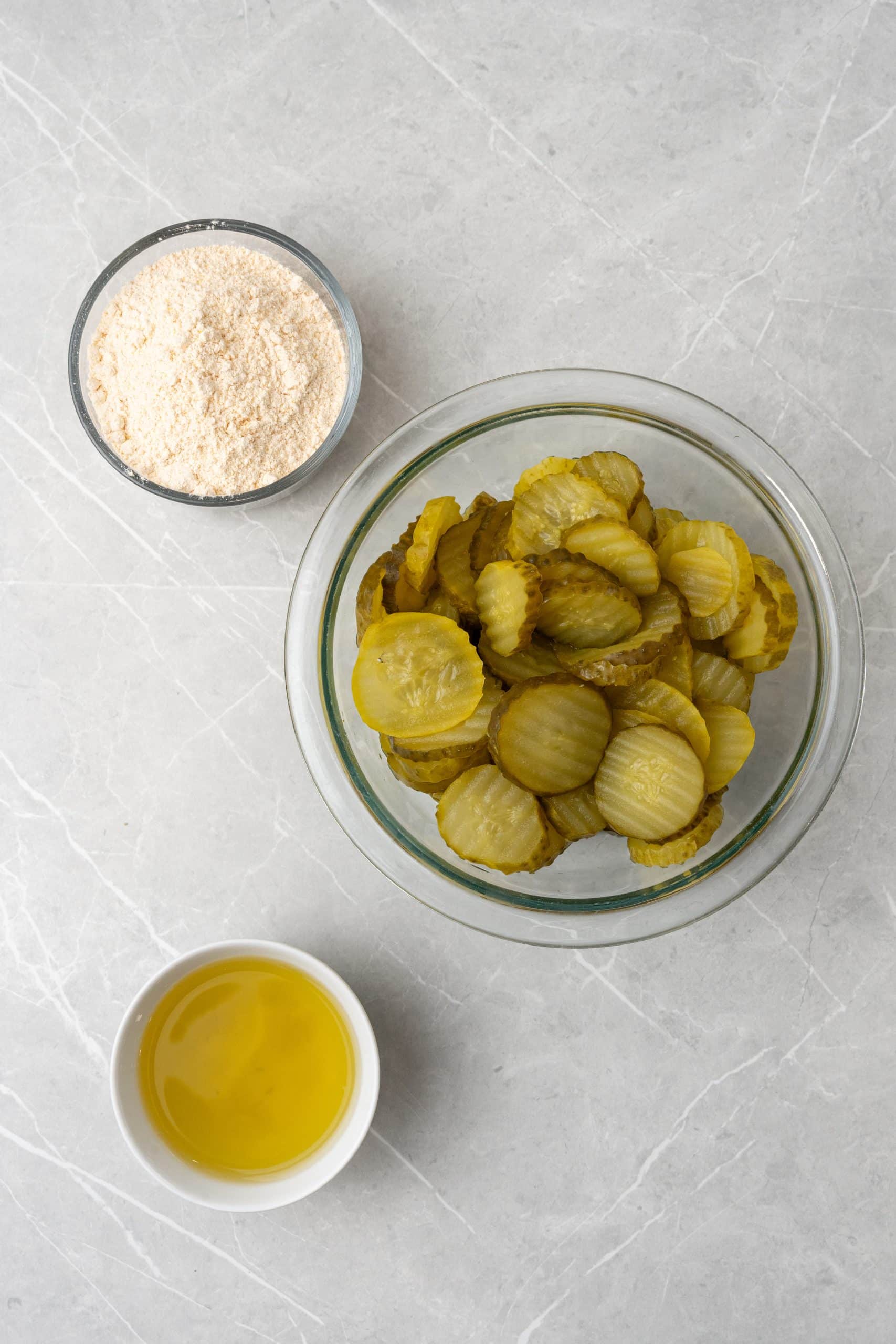 an overhead image showing the measured ingredients needed to make a batch of dill pickle fritters