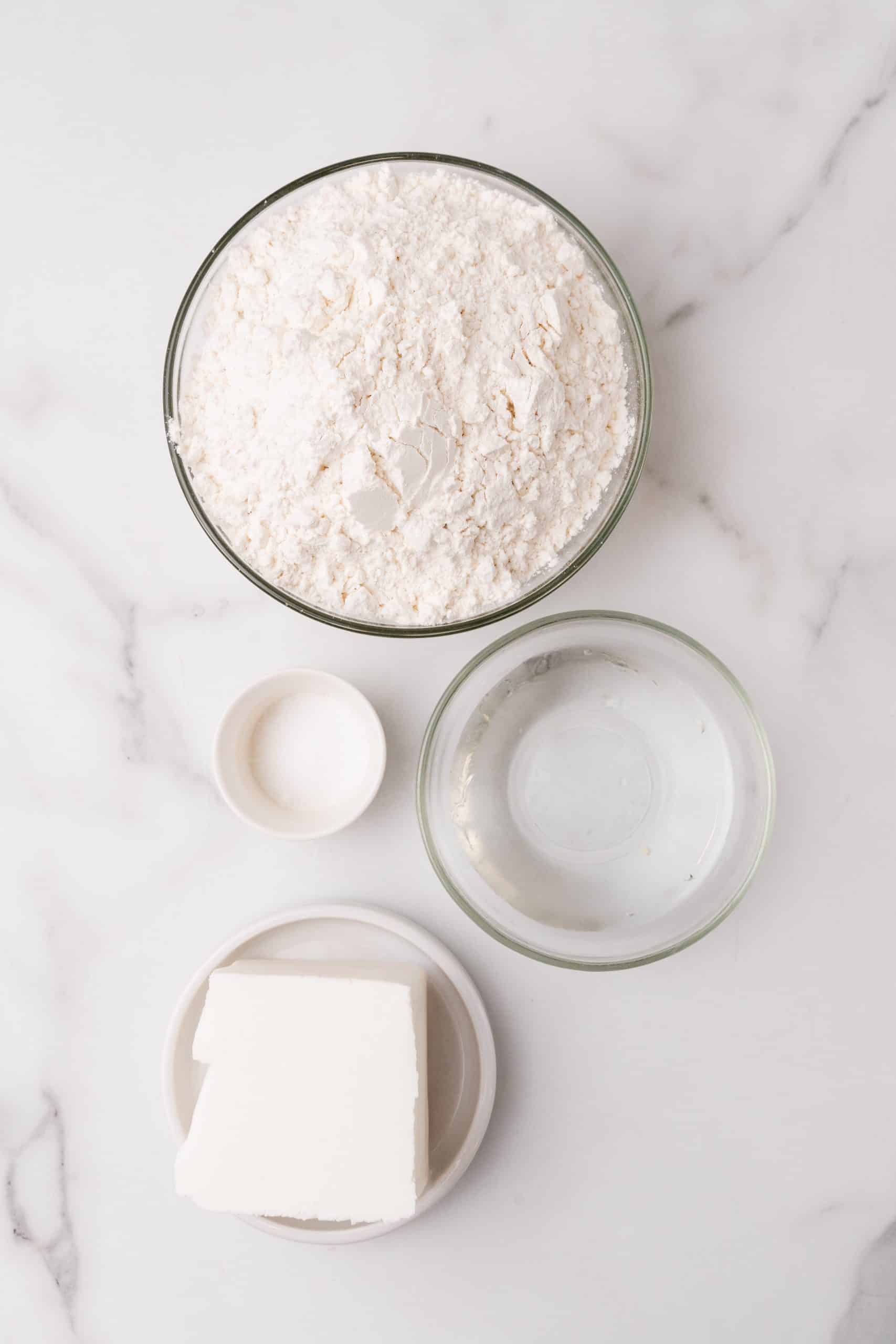 an overhead image showing the measured ingredients needed to make an easy homemade pie crust