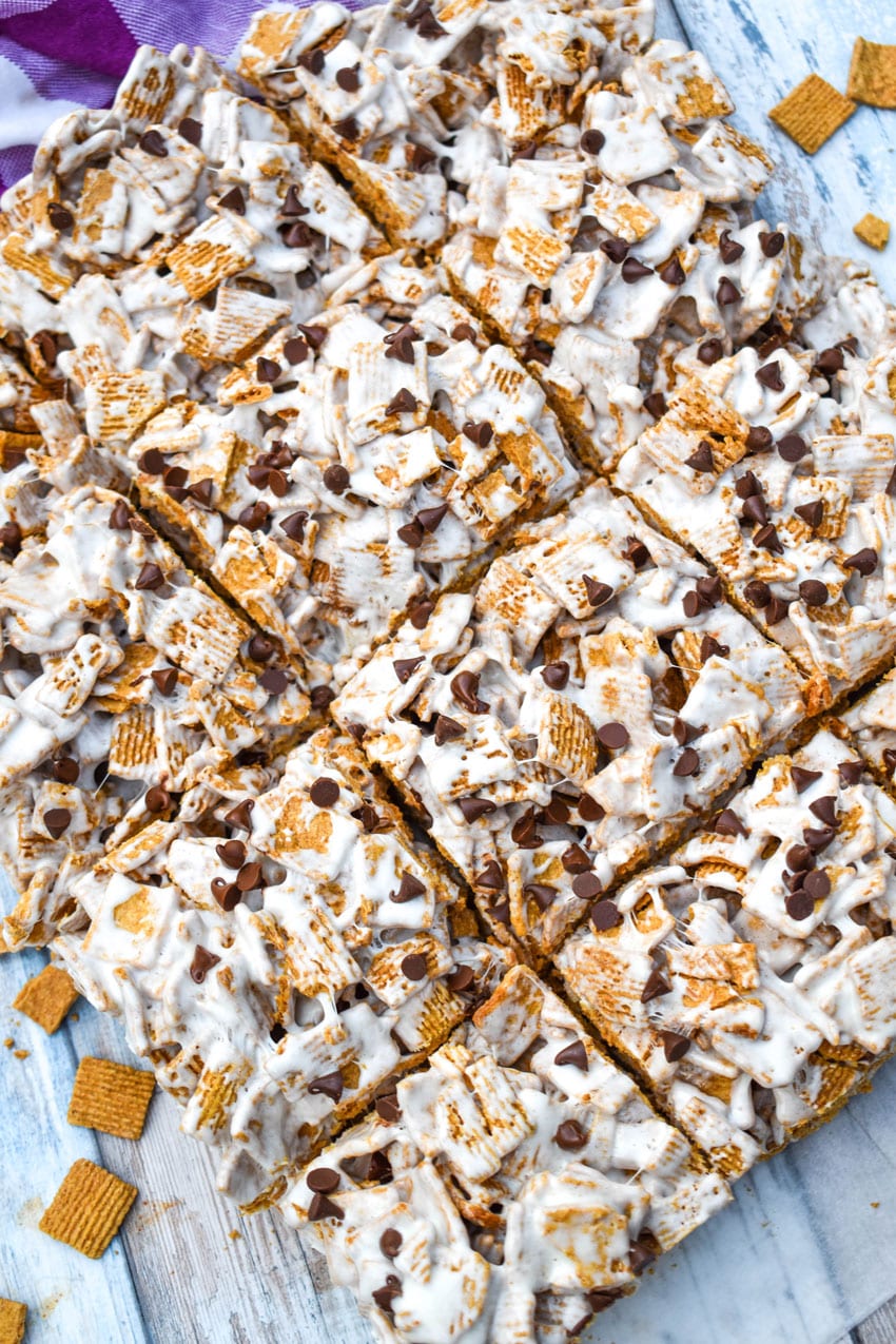 cut s'mores cereal bars on a sheet of white parchment paper