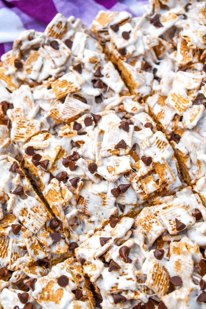 a close up of cut s'mores cereal bars on a sheet of white parchment paper