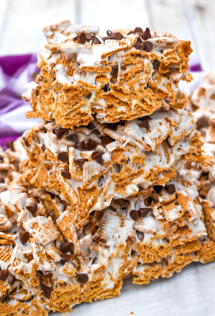 a stack of cut s'mores cereal bars on a wooden table