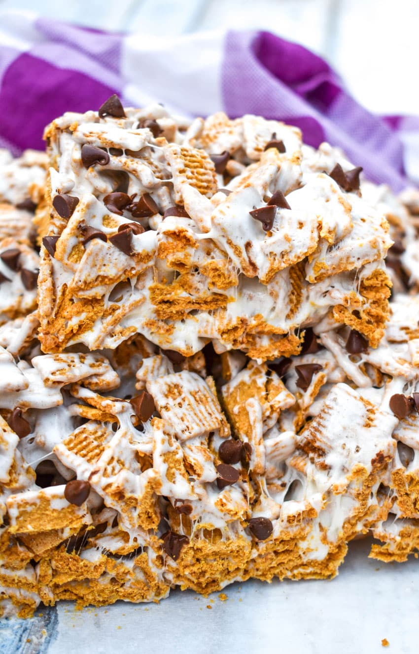 a stack of cut s'mores cereal bars on a wooden table
