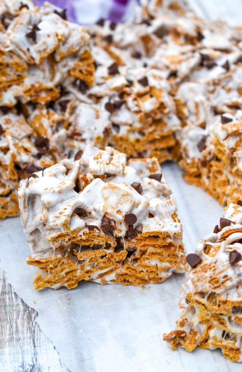 cut s'mores cereal bars on a sheet of white parchment paper