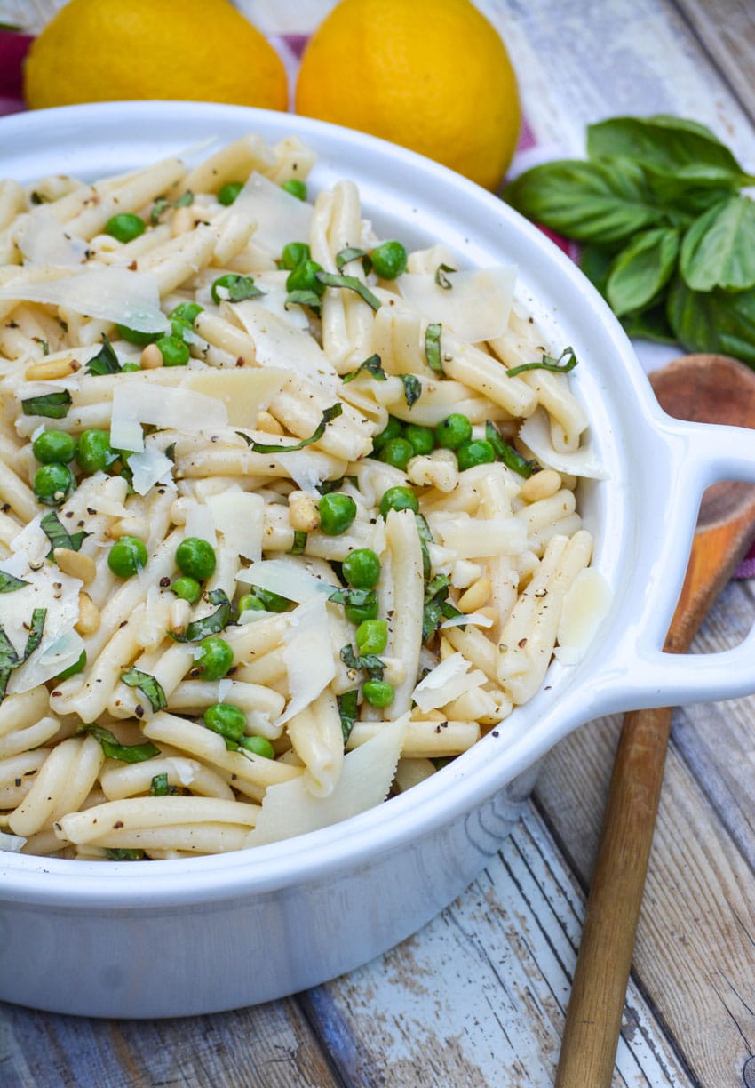lemon basil pasta salad in a white serving bowl