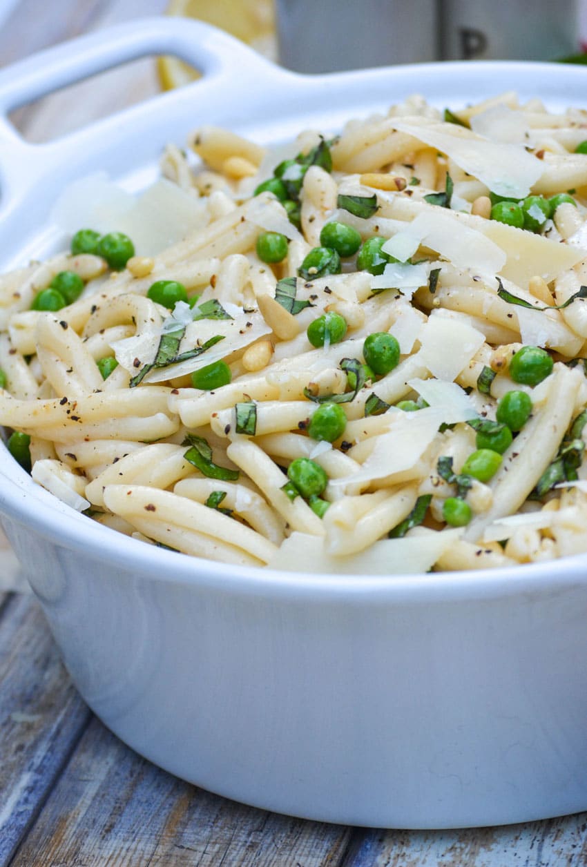 lemon basil pasta salad in a white serving bowl
