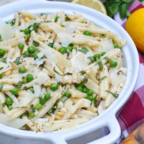 lemon basil pasta salad in a white serving bowl