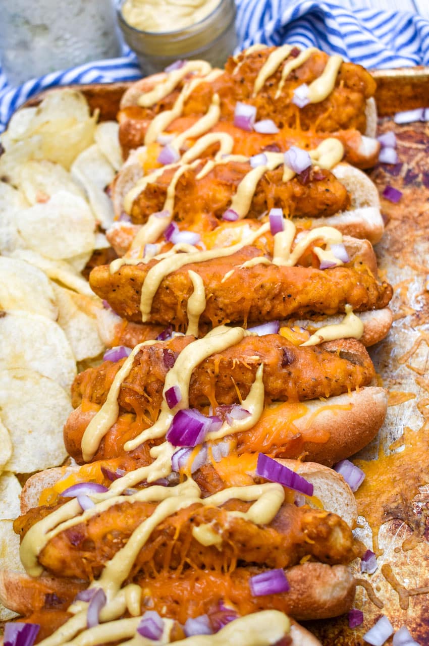 southern bird dog sandwiches arranged in a row on a metal sheet pan
