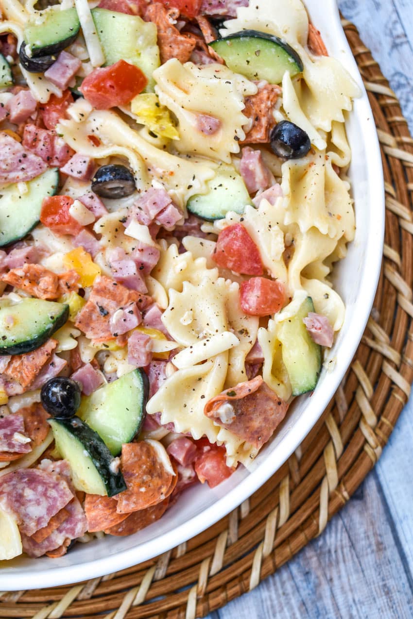 italian pasta salad in a large white serving bowl