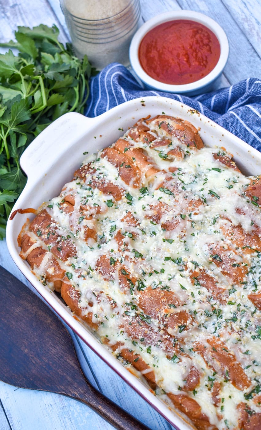 cheesy hawaiian roll garlic bread in a small white baking dish
