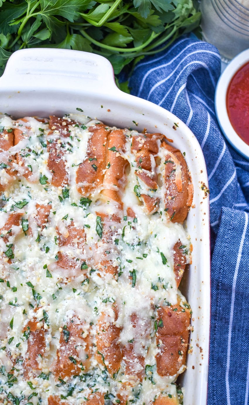 cheesy hawaiian roll garlic bread in a small white baking dish