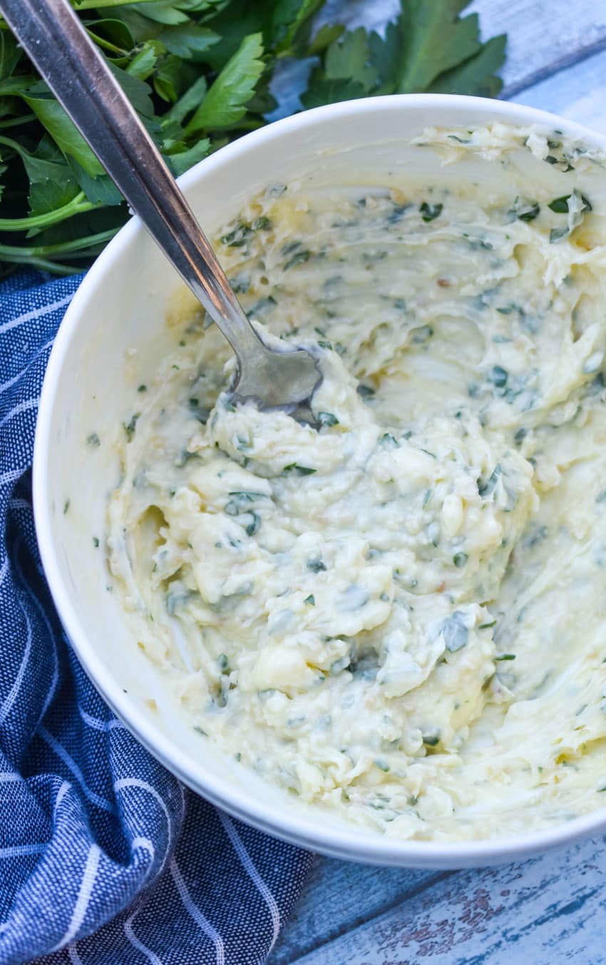 homemade garlic butter in a large white mixing bowl
