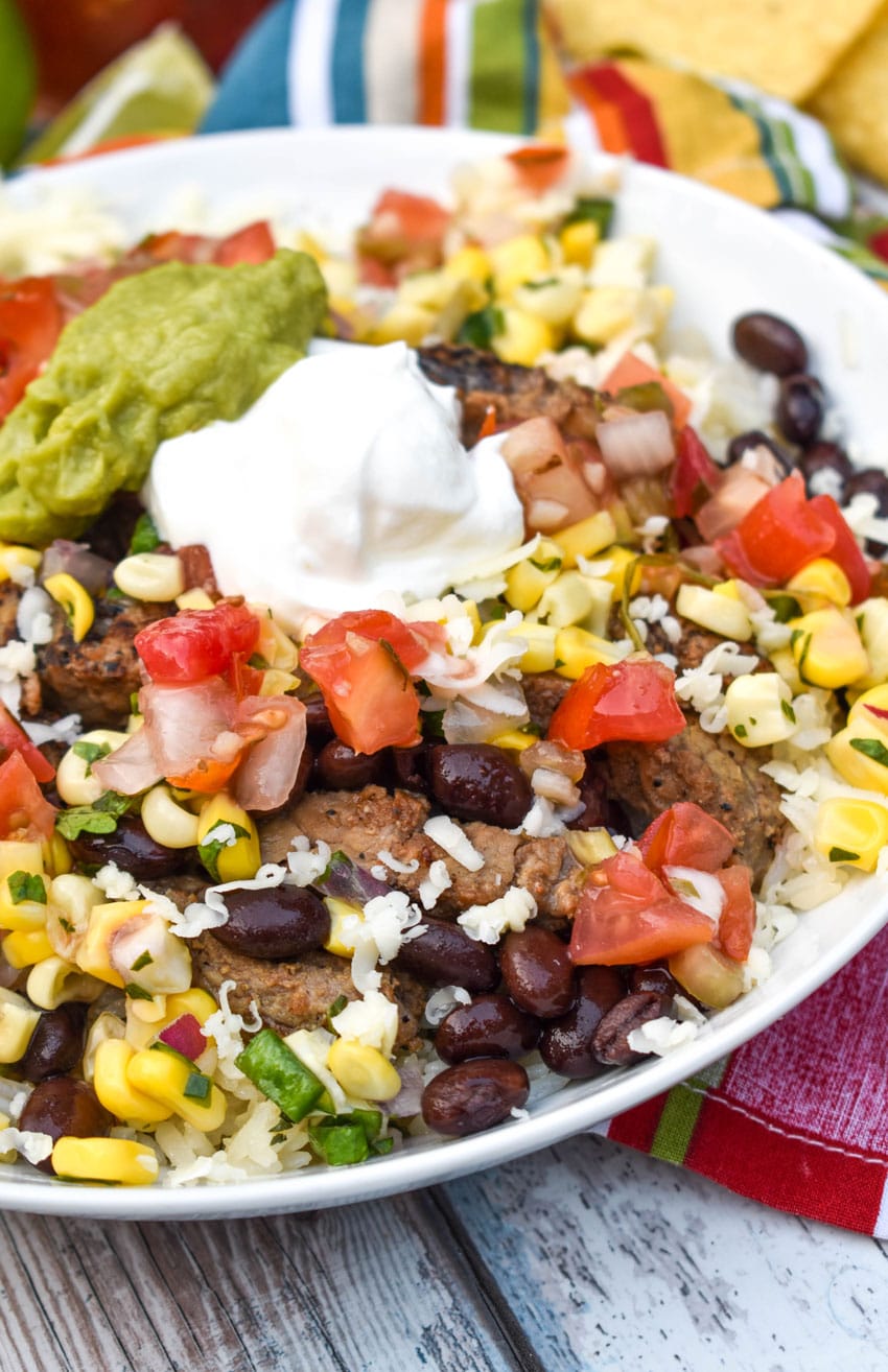 a close up of a copycat chipotle burrito bowl in a shallow white serving dish