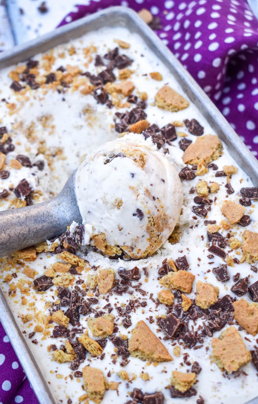 a silver scoop scooping homemade s'mores ice cream out of a metal loaf pan