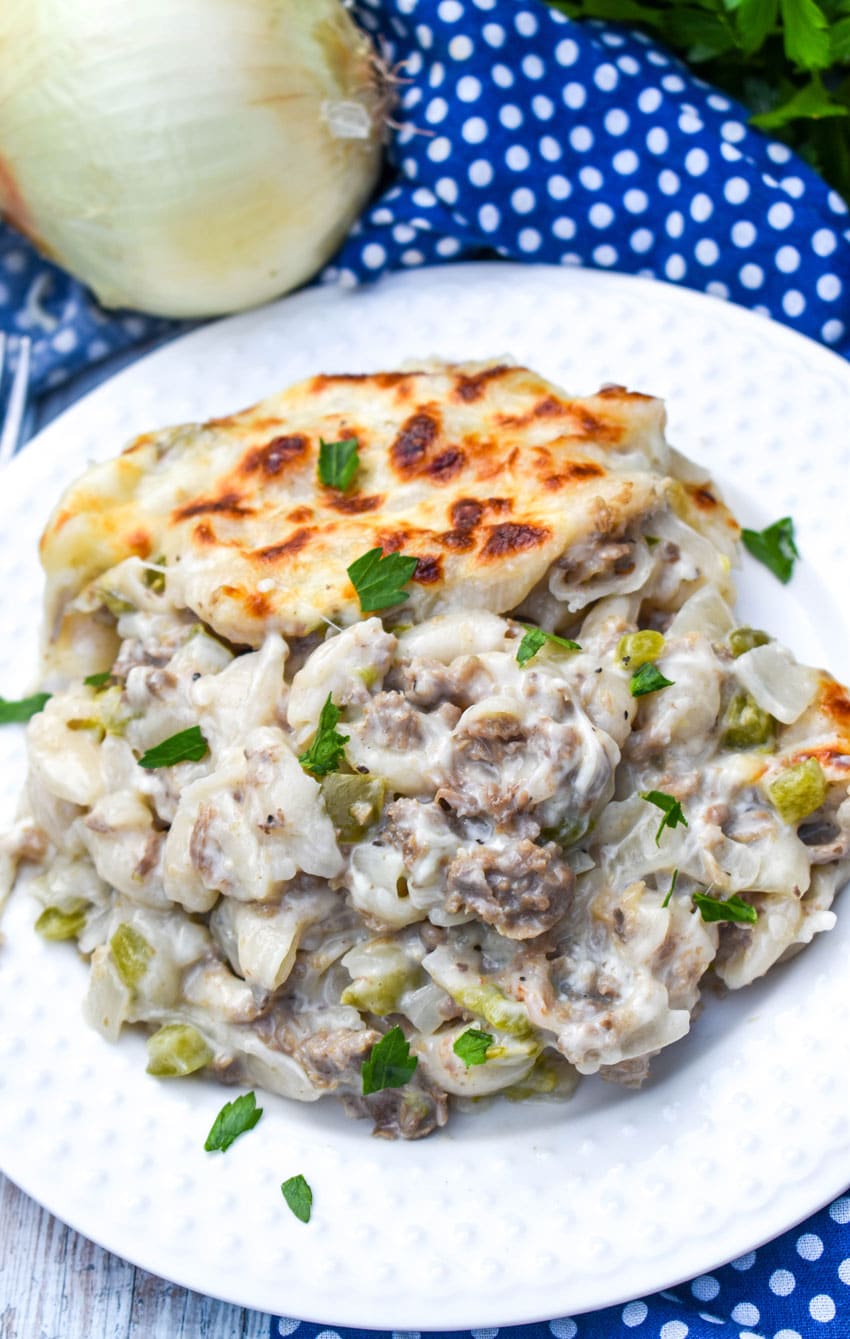 philly cheesesteak mac and cheese on a white plate