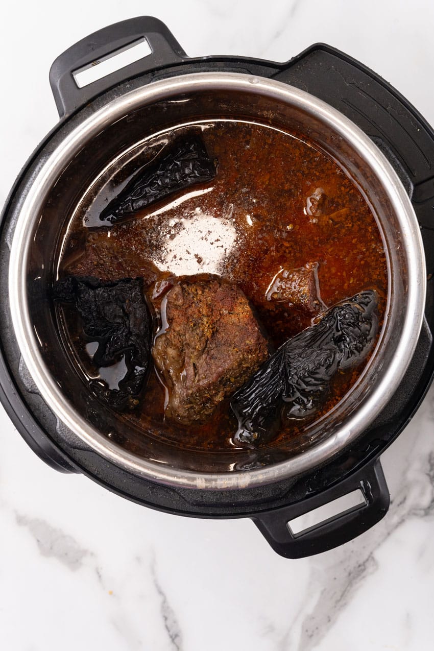 birria taco meat in the bowl of an instant pot