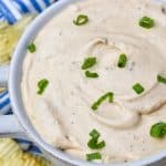 3 ingredient barbecue dip topped with sliced green onions in a small white bowl